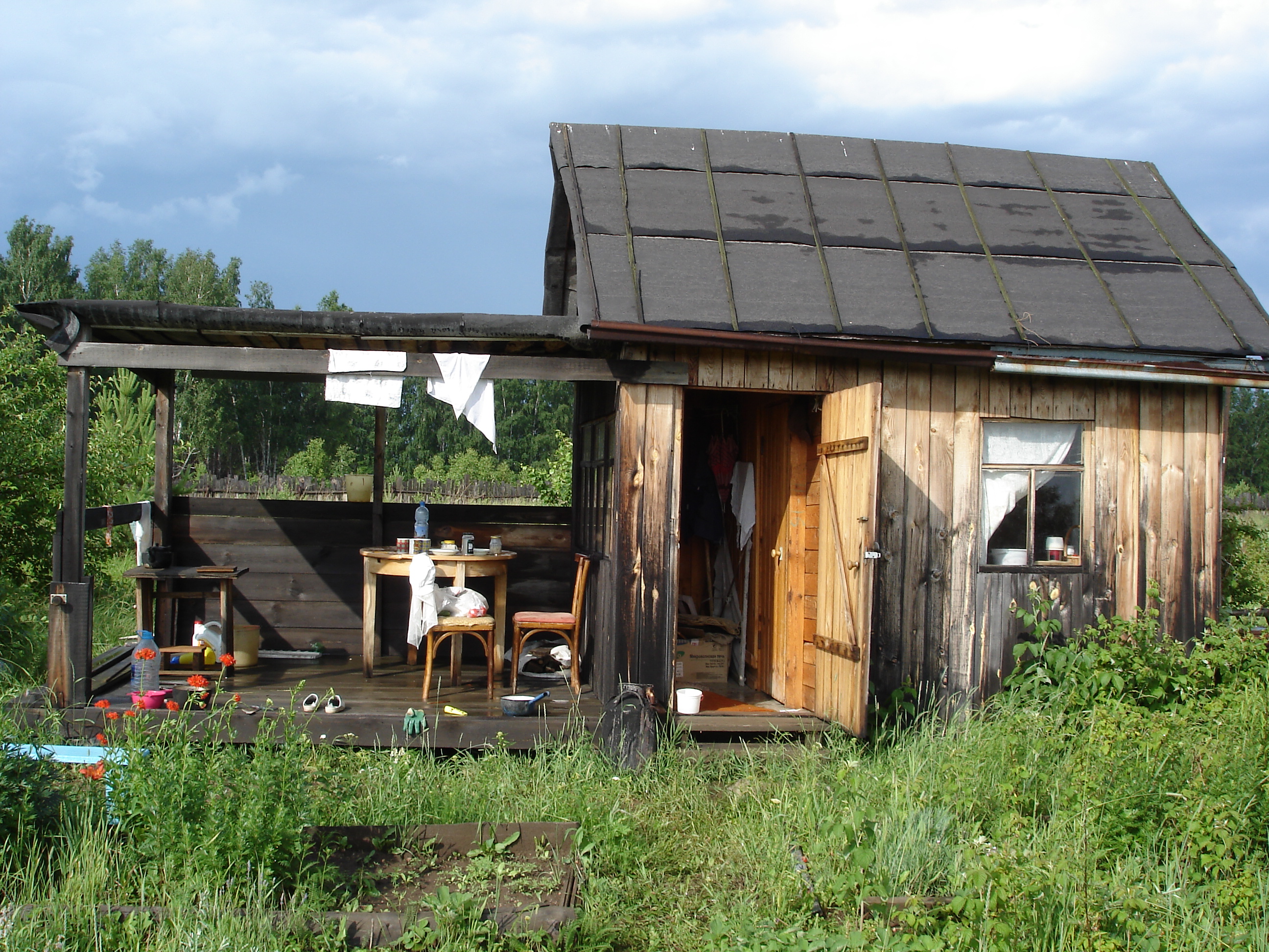 Old house with a veranda in the garden